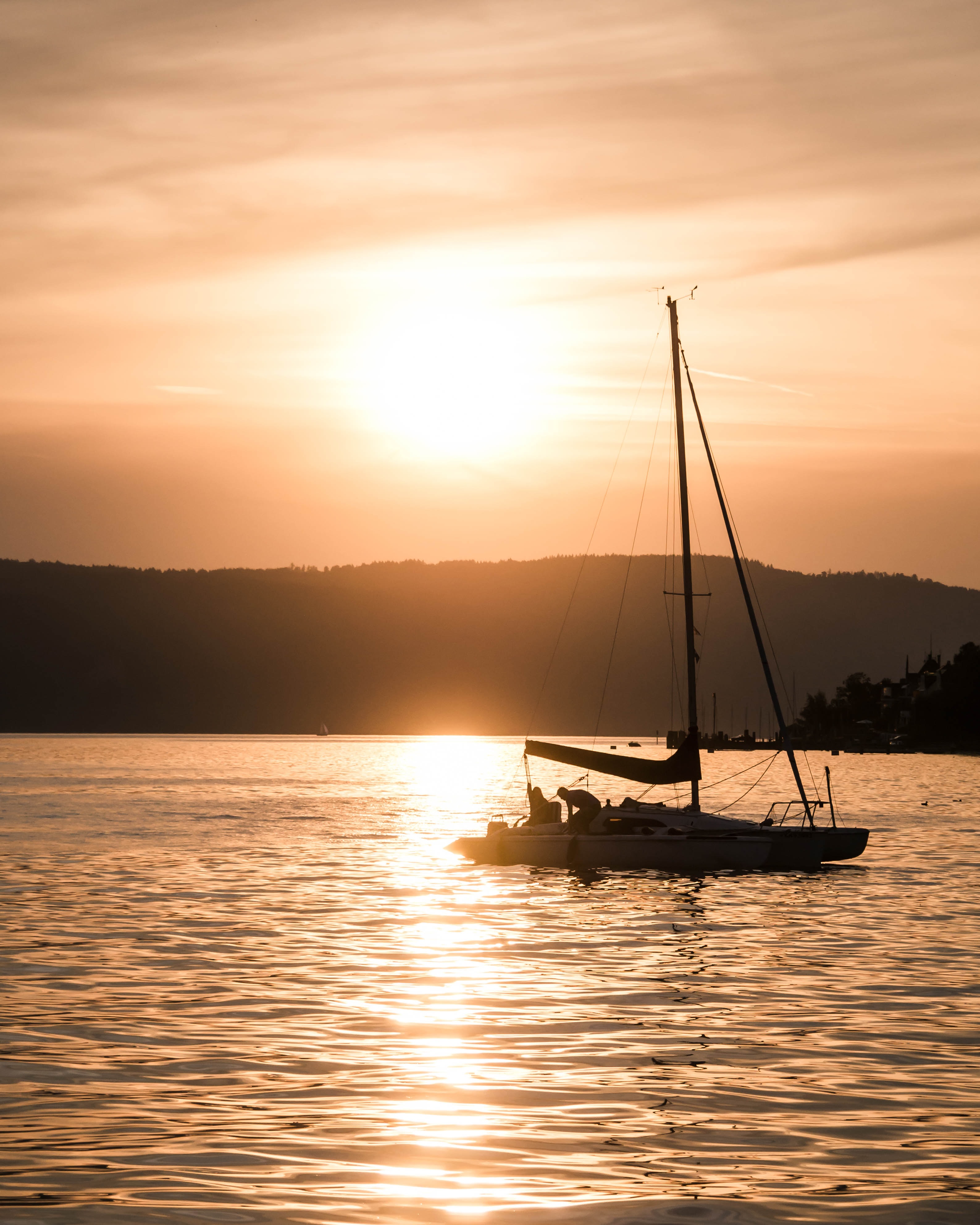 sailing boat on Lake Constance in the sunset
